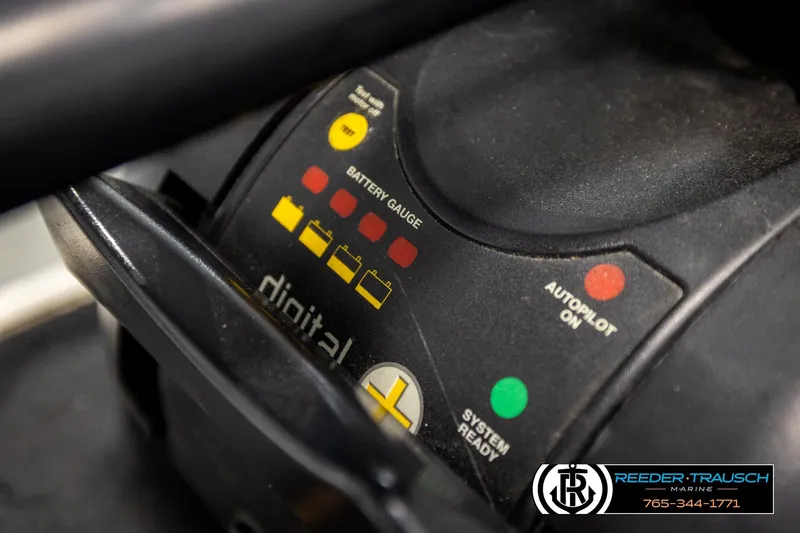 Slide: The Image of Close-up of a 2004 Crestliner 2050 Sportfish battery gauge and autopilot controls. - 47