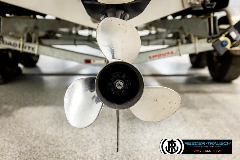 Slide: The Image of Close-up of a 2004 Crestliner 2050 Sportfish boat propeller on a trailer. - 52