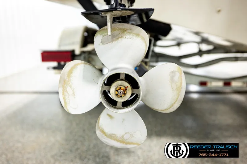 Slide: The Image of Close-up of a 2004 Crestliner 2050 Sportfish boat propeller in a showroom. - 56