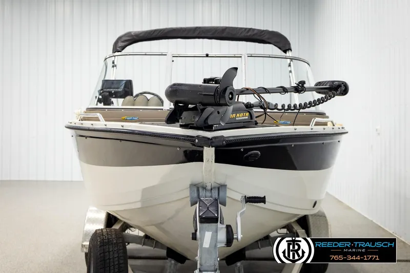 Slide: The Image of 2004 Crestliner 2050 Sportfish boat on trailer in indoor storage. - 7