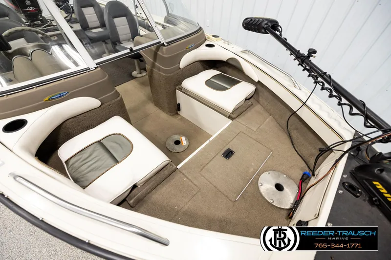 Slide: The Image of 2004 Crestliner 2050 Sportfish interior with seating and fishing equipment. - 8