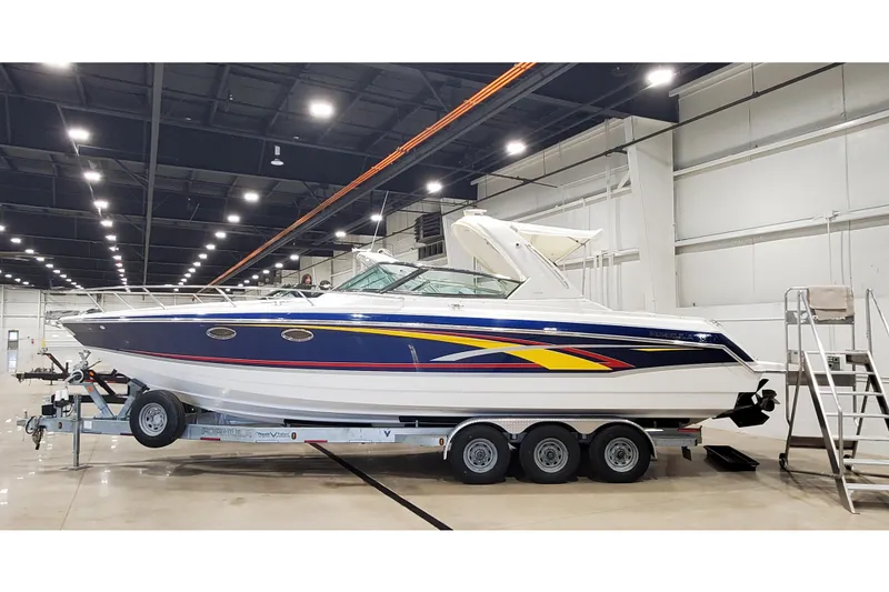 The Image of 2006 Formula 330 Sun Sport boat on trailer in indoor facility. - 1