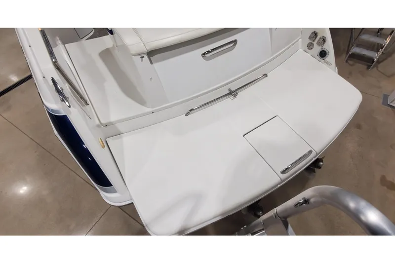 Slide: The Image of 2006 Formula 330 Sun Sport boat's rear deck with sleek white finish and stainless steel accents. - 10