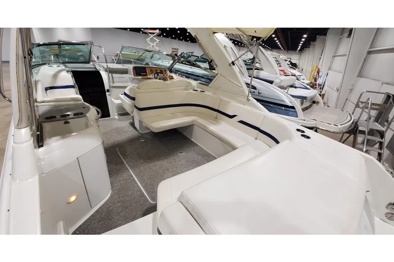 Slide: The Image of 2006 Formula 330 Sun Sport boat interior with white seating and modern dashboard. - 13
