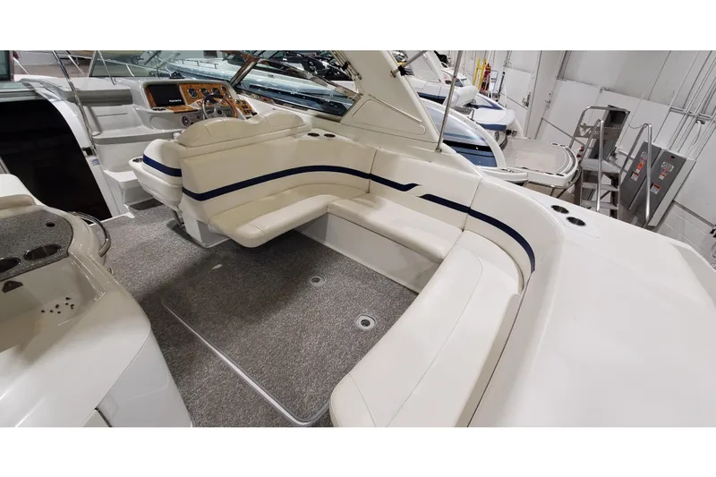 Slide: The Image of 2006 Formula 330 Sun Sport boat interior with plush seating and modern dashboard. - 14