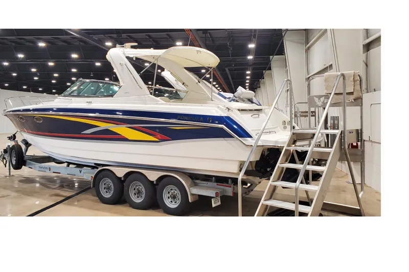 Slide: The Image of 2006 Formula 330 Sun Sport boat on trailer in indoor showroom. - 3