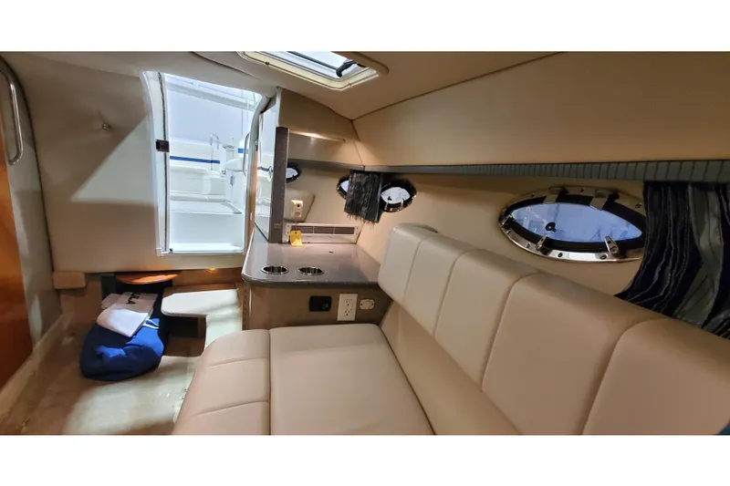 Slide: The Image of Interior of 2006 Formula 330 Sun Sport boat with seating and portholes. - 38