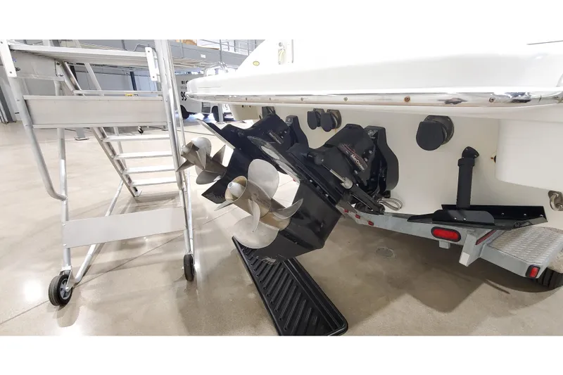 Slide: The Image of 2006 Formula 330 Sun Sport boat propeller and stern drive in a garage setting. - 42
