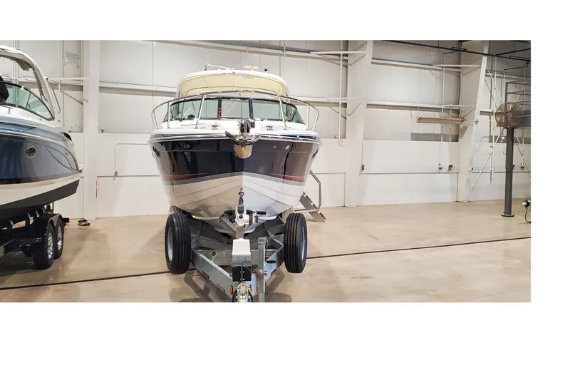 Slide: The Image of 2006 Formula 330 Sun Sport boat on trailer in indoor storage facility. - 7