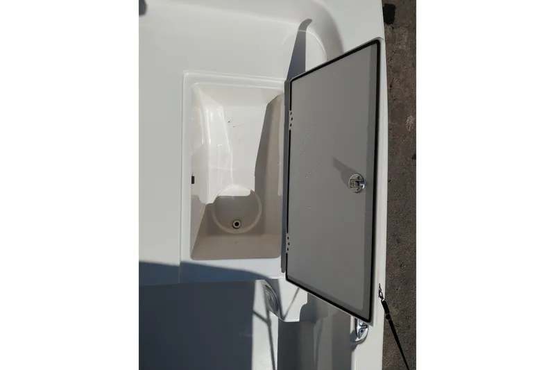 Slide: The Image of Open storage compartment on a 2021 Carolina Skiff 21 LS boat. - 11