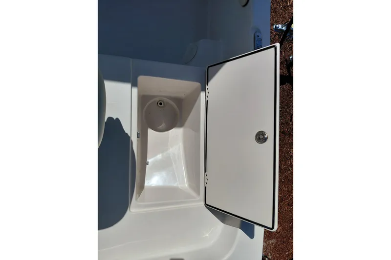 Slide: The Image of Open storage compartment on a 2021 Carolina Skiff 21 LS boat. - 12
