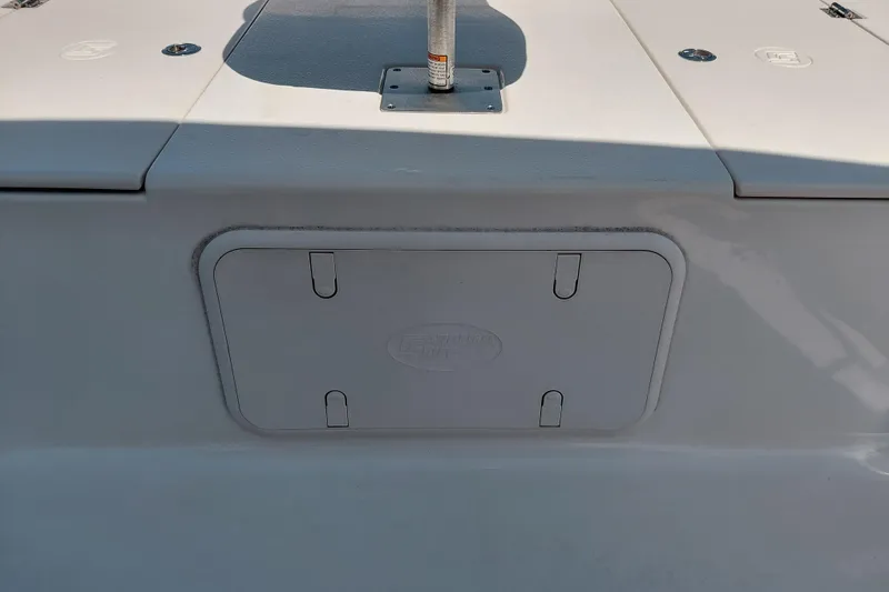 Slide: The Image of 2021 Carolina Skiff 21 LS boat deck with storage compartment. - 15