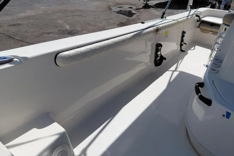Slide: The Image of 2021 Carolina Skiff 21 LS boat interior with padded side rail and rod holders. - 16