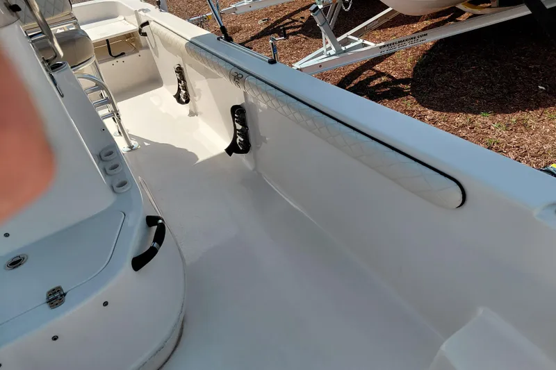 Slide: The Image of 2021 Carolina Skiff 21 LS boat interior with seating and storage compartments. - 20