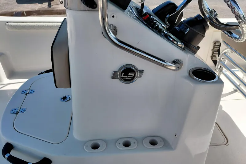 Slide: The Image of 2021 Carolina Skiff 21 LS boat console with steering wheel and control panel. - 21