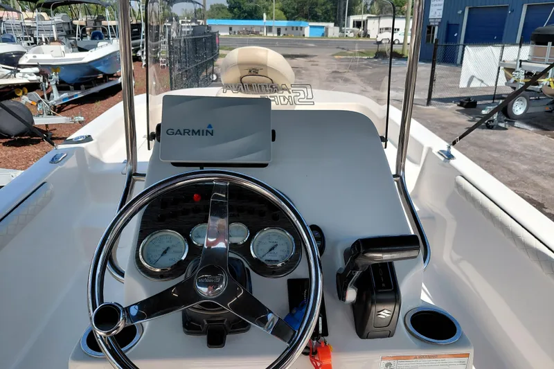 Slide: The Image of 2021 Carolina Skiff 21 LS boat dashboard with Garmin navigation system. - 22