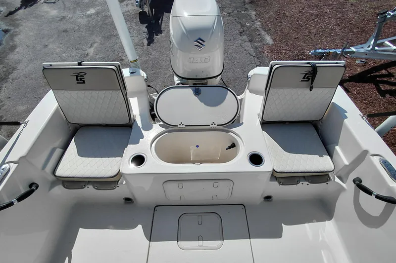 Slide: The Image of 2021 Carolina Skiff 21 LS boat interior with seating and storage compartments. - 28
