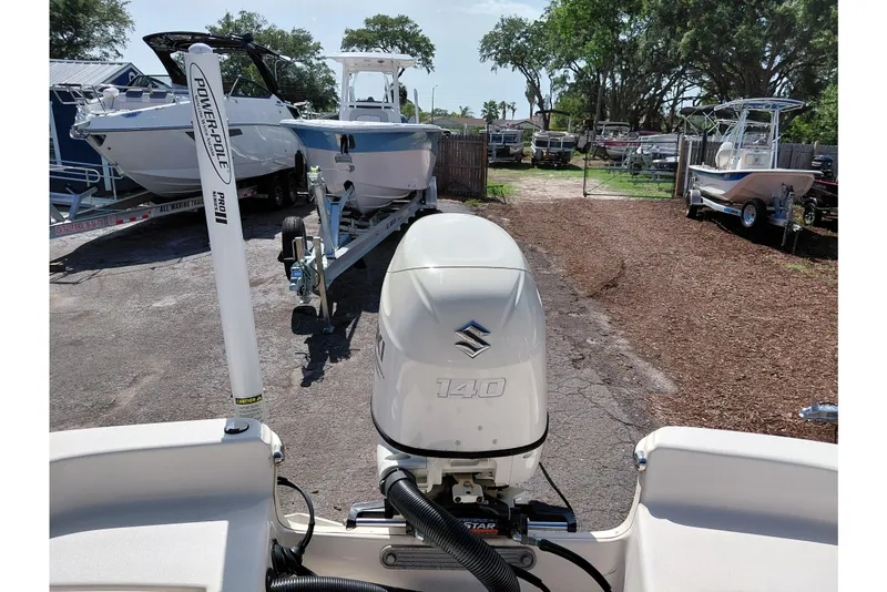 Slide: The Image of 2021 Carolina Skiff 21 LS with Suzuki 140 engine, parked on a trailer. - 35
