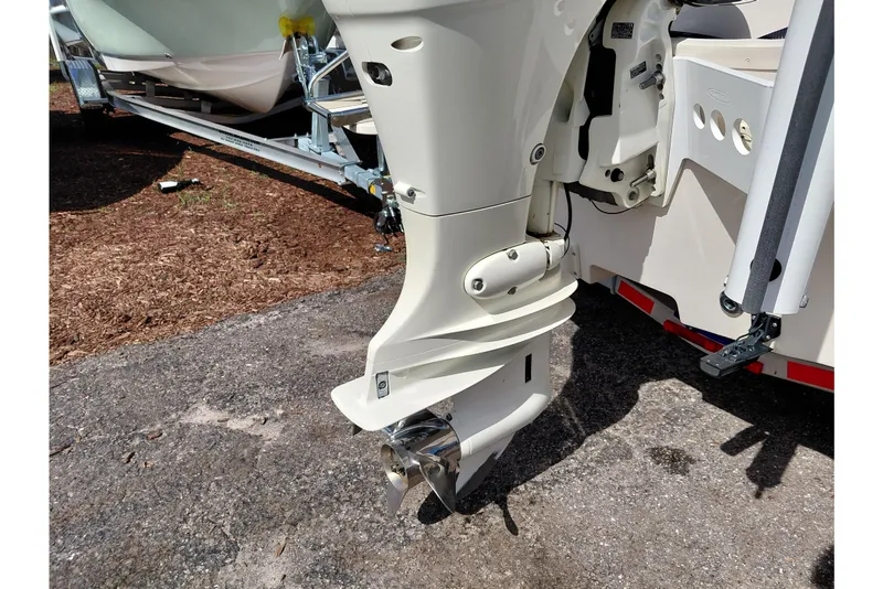 Slide: The Image of Outboard motor of a 2021 Carolina Skiff 21 LS boat on a trailer. - 45