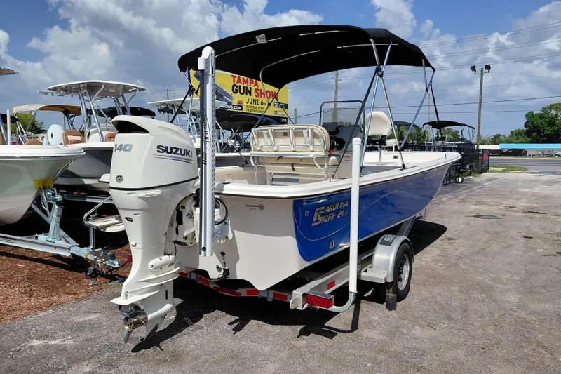 Slide: The Image of 2021 Carolina Skiff 21 LS boat with Suzuki 140 outboard motor on trailer. - 7