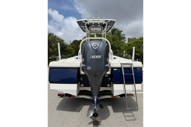 Slide: The Image of 2015 Robalo 246 Cayman boat with Yamaha 300 engine, rear view. - 4