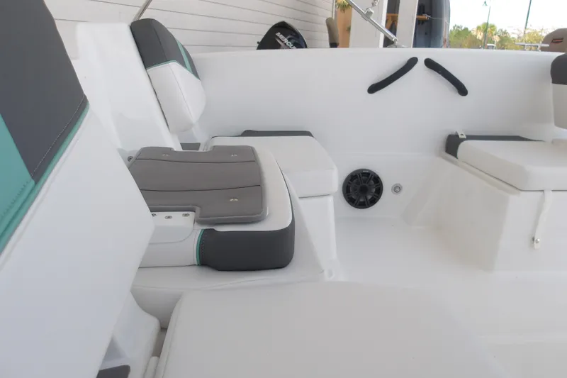Slide: The Image of 2026 Tahoe T18 boat interior with cushioned seating and speaker system. - 9