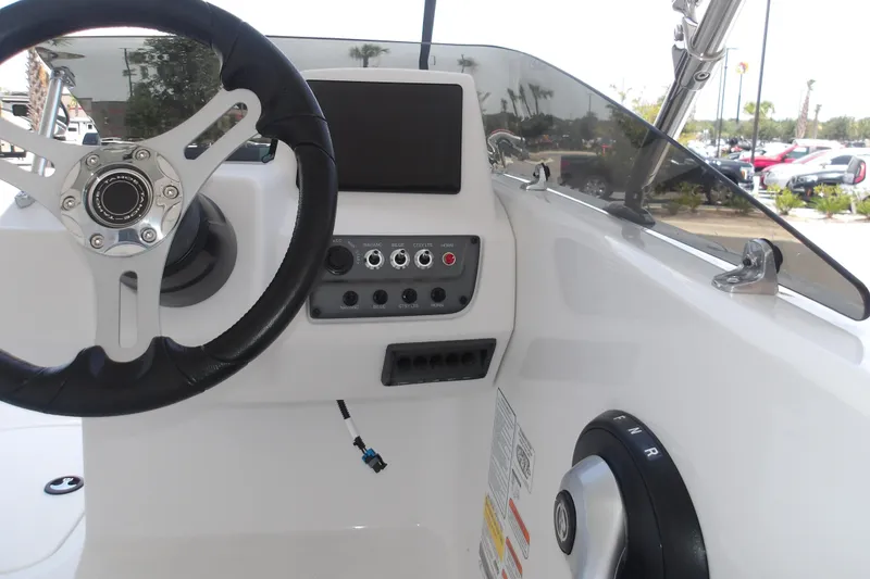 Slide: The Image of Steering console of 2026 Tahoe T18 boat with controls and display screen. - 15