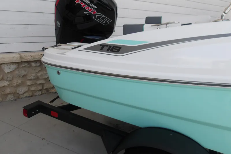 Slide: The Image of 2026 Tahoe T18 boat with Mercury Pro XS engine on trailer, light blue hull. - 4
