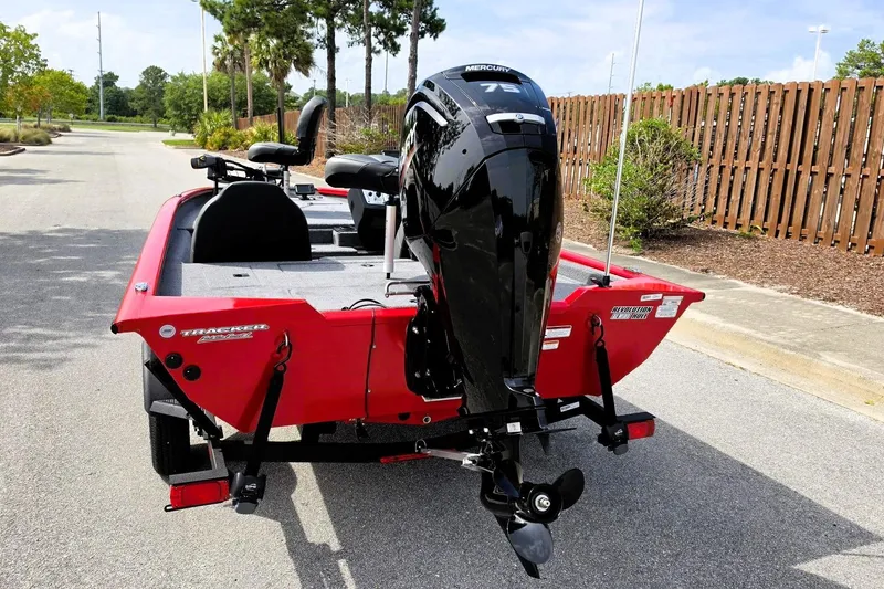 Slide: The Image of 2026 Tracker Pro Team 175 boat with Mercury 75 engine, parked on a sunny street. - 14