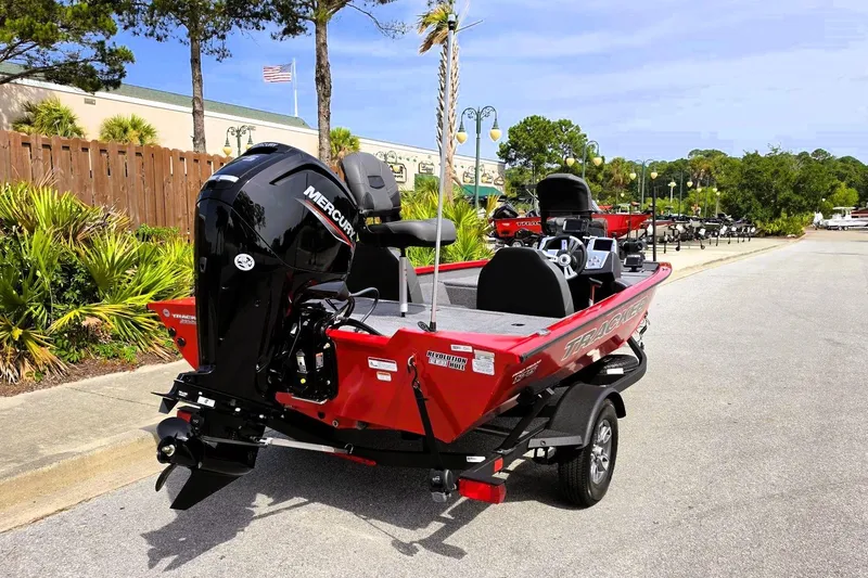 Slide: The Image of 2026 Tracker Pro Team 175 boat with Mercury engine, parked outdoors. - 4