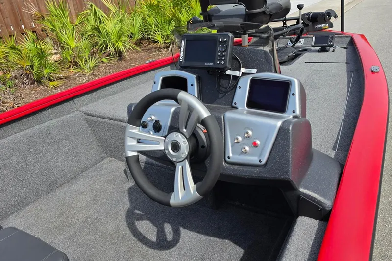 Slide: The Image of 2026 Tracker Pro Team 175 boat interior with steering wheel and electronic displays. - 15