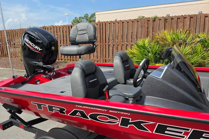 Slide: The Image of 2026 Tracker Pro Team 175 boat with Mercury engine, red exterior, and comfortable seating. - 16
