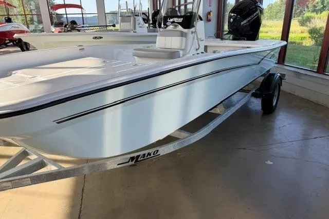 The Image of 2026 Mako Pro Skiff 17 CC boat displayed indoors on a trailer. - 0