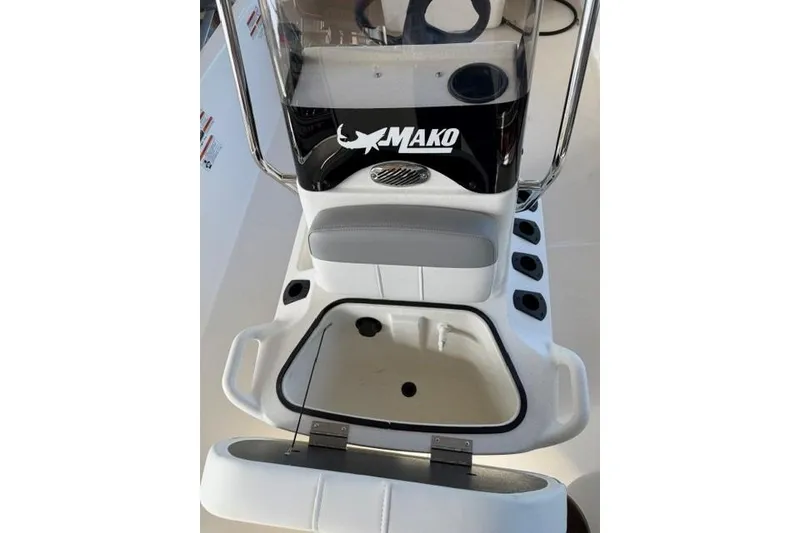 Slide: The Image of 2026 Mako Pro Skiff 17 CC boat console with storage compartment and seating. - 8