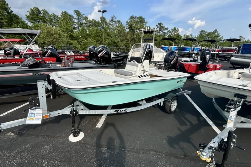 The Image of 2026 Mako Pro Skiff 13 CC boat on trailer in outdoor showroom. - 0