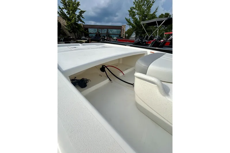 Slide: The Image of 2026 Mako Pro Skiff 13 CC boat interior with storage compartment and seating. - 6