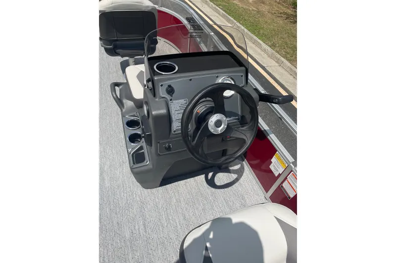 Slide: The Image of Steering console of 2026 Sun Tracker Bass Buggy 16 XL Select pontoon boat. - 4