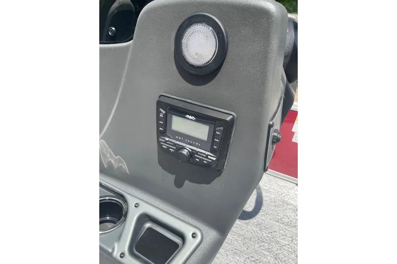 Slide: The Image of 2026 Sun Tracker Bass Buggy 16 XL Select dashboard with audio system and speaker. - 5