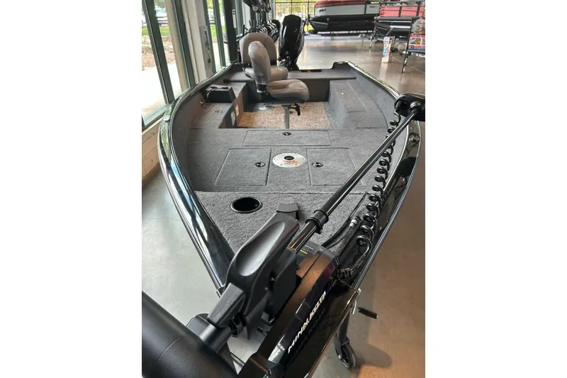 Slide: The Image of 2026 Tracker Super Guide V-16 T fishing boat interior with seating and storage compartments. - 4