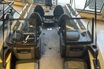 Slide: The Image of 2026 Tracker Targa V-18 Combo boat interior with seating and control panel. - 4