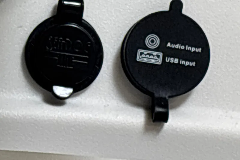 Slide: The Image of Audio and USB input ports on 2026 Tahoe T18 boat. - 16
