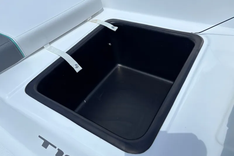 Slide: The Image of 2026 Tahoe T18 boat storage compartment with open lid, showcasing spacious interior. - 25