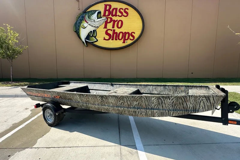 The Image of 2026 Tracker Grizzly 15 Jon boat on trailer outside Bass Pro Shops. - 9