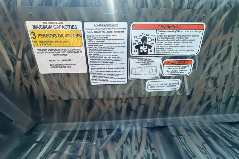 Slide: The Image of Safety and capacity labels on 2026 Tracker Grizzly 15 Jon boat interior. - 24