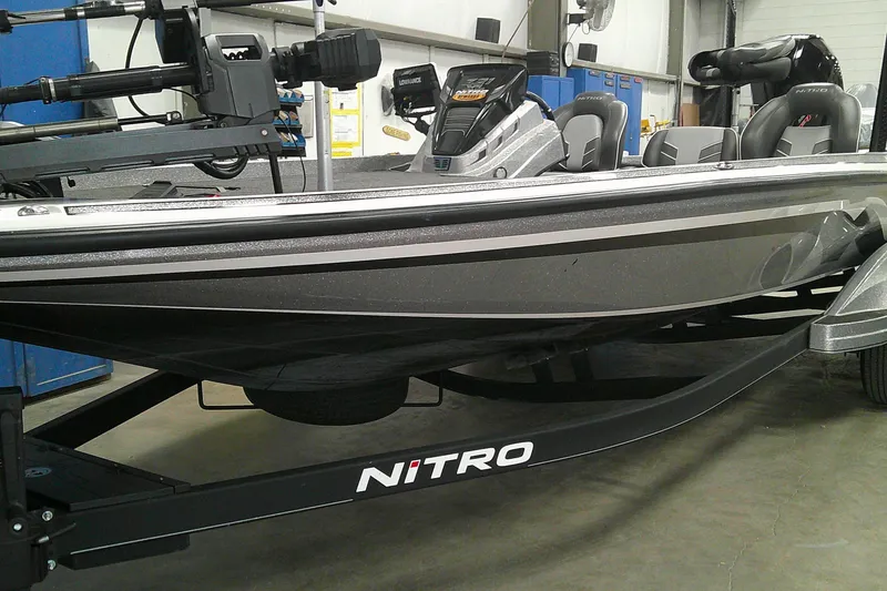 The Image of 2024 Nitro Z21 XL boat in a showroom, showcasing sleek design and advanced features. - 0