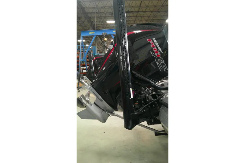Slide: The Image of 2024 Nitro Z21 XL boat with Mercury Pro XS engine in a warehouse setting. - 13