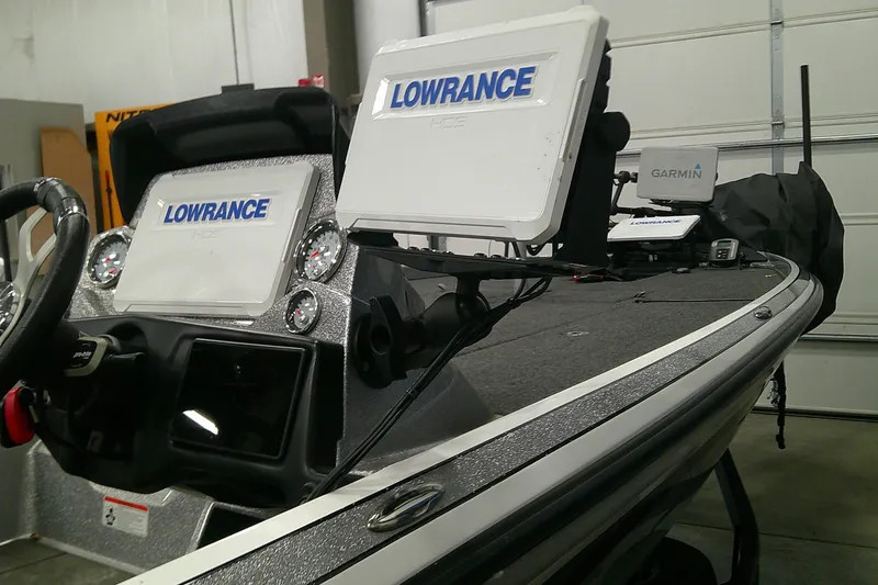 Slide: The Image of 2024 Nitro Z21 XL boat dashboard with Lowrance and Garmin electronics. - 2