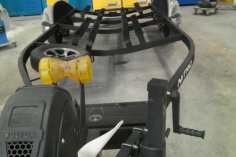 Slide: The Image of 2024 Nitro Z21 XL boat trailer in a workshop setting. - 3