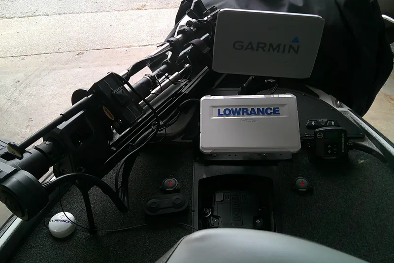 Slide: The Image of 2024 Nitro Z21 XL boat dashboard with Garmin and Lowrance electronics. - 6