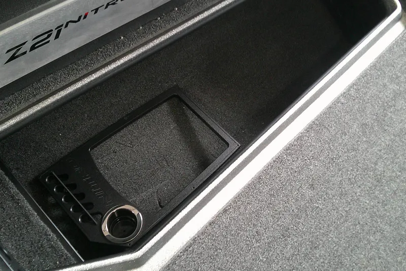 Slide: The Image of 2024 Nitro Z21 XL boat storage compartment with cup holder. - 8